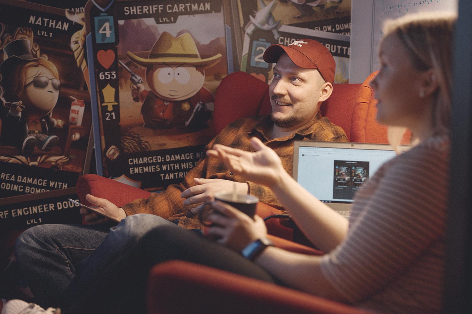 Ubisoft RedLynx colleagues having a negotiation with SouthPark Phone Destroyer posters in the background