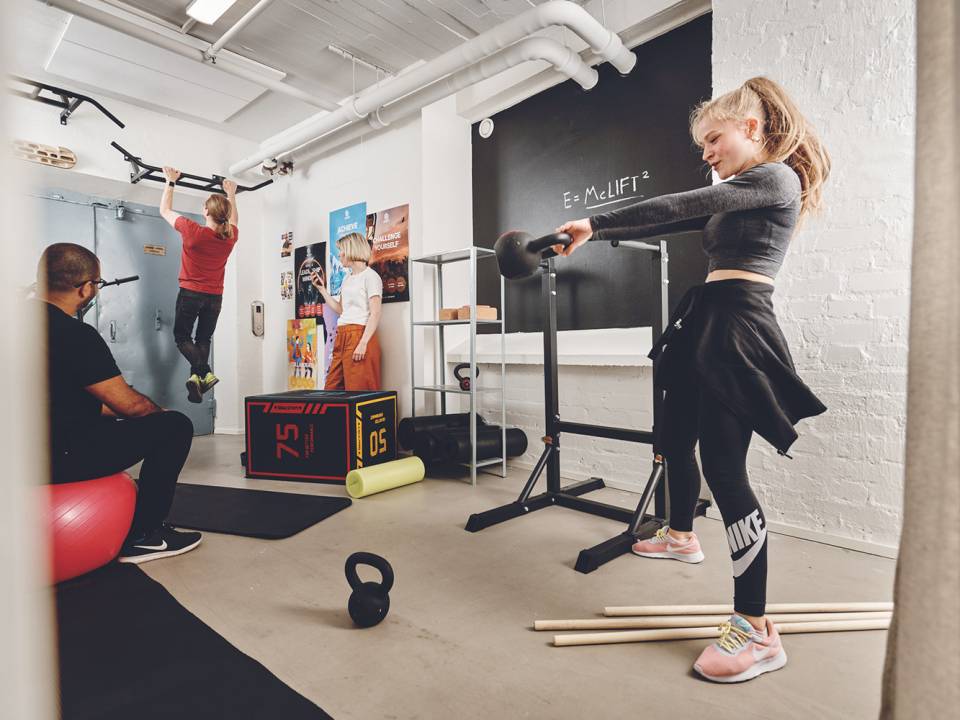 Employees working out at RedLynx studio Helsinki Finland