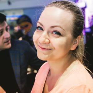 Associate Producer Anastasia Blokhina smiling to the camera.